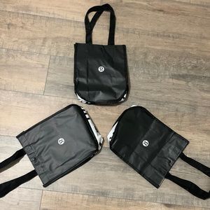 Three lululemon shopping bags